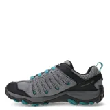Championes de trekking Merrell Crosslander 3, color gris con detalles en negro y turquesa. Confeccionados en cuero de gamuza y malla transpirable, cuentan con tecnología Air Cushion en el talón para mayor estabilidad y absorción de impactos, además de una suela de goma resistente para terrenos irregulares.