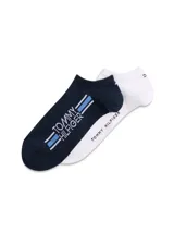 Pack de dos pares de medias cortas tipo sneaker de Tommy Hilfiger, confeccionadas en mezcla de algodón, poliamida y elastano. Incluye un par azul marino con logo y rayas laterales, y un par blanco con el nombre de la marca en el lateral.