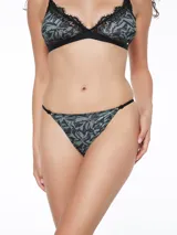 Colaless estampada con motivos abstractos en tonos verde, gris y negro.