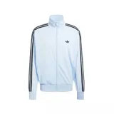 Campera deportiva Adidas Firebird color celeste con cierre frontal, cuello alto y bolsillos laterales con cierre. Presenta las icónicas tres tiras negras en los hombros y mangas, y el logo del trifolio bordado en el pecho.