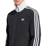 Campera deportiva Adidas modelo Beckenbauer, color negro con cuello alto, puños y cintura en color blanco. Presenta las icónicas tres tiras blancas en los hombros y mangas, cierre frontal completo y logo del trébol bordado en el pecho.