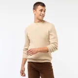 Sweater de punto con textura gofrada, cuello redondo y mangas largas, de corte estándar.
