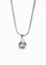 Cadena omega italiana de plata 925 con dije redondo con topacio azul.