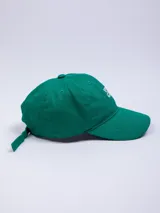 Gorro marrón de gabardina con visera y bordado frontal con la frase "You are Good" en color blanco.