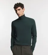 Buzo de corte slim con cuello alto y mangas largas, confeccionado en tejido de punto liso.