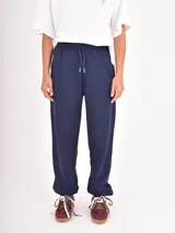 Pantalon de jogging azul marino con cintura elastizada y cordón de ajuste frontal.