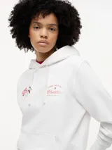Buzo con capucha de Tommy Hilfiger en colaboración con Cadillac Formula 1 Team. Confeccionado en algodón, presenta un diseño de corte regular con hombros caídos, bolsillo tipo canguro y puños acanalados. En el pecho incluye un gráfico bordado con banderas cruzadas y el logo de la colaboración.