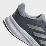 Championes de running Adidas Response color gris con detalles plateados y suela blanca con línea verde.