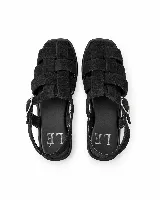 Sandalias Loop de cuero genuino color negro, con diseño de tiras entrelazadas, tira trasera y hebilla metálica.