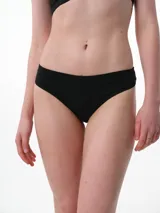 Colaless de algodón negro con textura de punto jacquard y tiro medio.