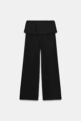 Pantalón de algodón compacto color beige, de tiro alto con cintura elástica y detalle de fajín y cordones.