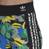 Calza larga Adidas con estampado floral multicolor y las tres líneas clásicas de la marca en los laterales.