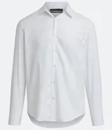 Camisa blanca de algodón, corte slim fit, manga larga y cuello clásico.