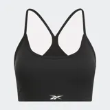 Sostén deportivo negro con tirantes finos que forman un patrón triangular en la espalda y logo de Reebok en el frente.