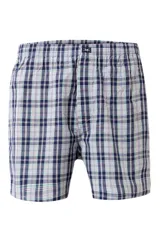 Calzoncillo tipo bóxer de tela a cuadros, en tonos azul marino, verde y blanco, con cintura elástica y pequeña etiqueta con logo en la parte central.