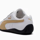 Championes Puma Speedcat LTH, color blanco con detalles en dorado y suela negra.