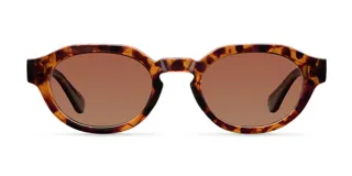 Lentes de sol con montura geométrica de acetato color carey (tortoise) y cristales marrones polarizados. El diseño combina una parte superior plana con una parte inferior redondeada.