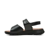 Sandalia casual de cuero Usaflex modelo Ainara, color negro con plataforma baja y plantilla marrón. Cuenta con tiras ajustables con cierre de velcro y el logo de la marca en el empeine.