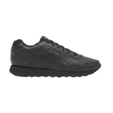 Championes urbanos Reebok modelo Glide, color negro, con diseño clásico de caña baja, confeccionados en material sintético con detalles de costuras y logo de la marca en el lateral y lengüeta.