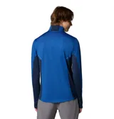 Remera de manga larga Columbia con tecnología Omni-Wick, diseñada para actividades deportivas. Presenta cuello con media cremallera, paneles laterales en tono azul más oscuro, orificios para los pulgares en los puños y detalles reflectantes.