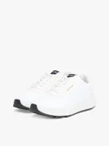 Zapatillas deportivas Tommy Hilfiger de corte bajo, color blanco, confeccionadas en tejido de punto de poliéster, con forro de poliéster, plantilla extraíble de poliuretano y suela de EVA. Presentan logo Hilfiger en relieve en el lateral y cinta distintiva en la entresuela.