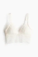 Soutien bralette de encaje color beige, con relleno extraíble, breteles ajustables y ribete ancho en el bajo.