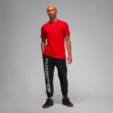 Camiseta roja de algodón con cuello redondo y logo "Jordan Sport" estampado en el pecho.