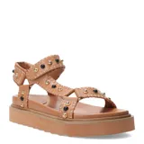 Sandalias de plataforma estilo Teva color tostado, con tiras ajustables decoradas con tachas metálicas doradas y piedras negras. Poseen suela de goma dentada y cierre de velcro.