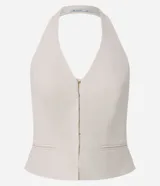 Blusa sastrera color marfil de corte halter con escote en V, cierre frontal con ganchos y bolsillos ribeteados simulados.