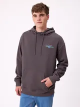 Canguro gris claro con capucha y estampado trasero en azul. El estampado incluye el texto "Spirit League Rusty Team" y una ilustración de una camioneta con animales y tablas de surf.