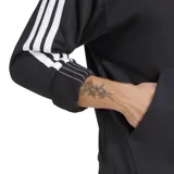 Canguro deportivo Adidas con capucha y cordones ajustables, color negro con las icónicas tres tiras blancas en las mangas y logo de la marca bordado en el centro del pecho. Cuenta con un bolsillo frontal tipo canguro y puños acanalados.