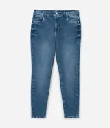 Pantalón de jean skinny azul con deshilachados, tiro alto y ajuste elástico en la cintura. Confeccionado en algodón BCI.