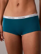 Bombacha hípster color azul petróleo de algodón elástico, con cintura elástica blanca con logo Calvin Klein.