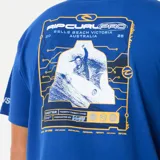 Remera azul con estampado amarillo del logo de Rip Curl Pro 25 Event en el pecho.