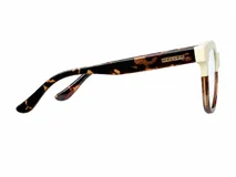 Lentes blueblocker Mahé Willsi con armazón cuadrado de diseño bicolor, combinando tono crema en la parte superior y carey en la inferior.