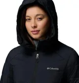 Campera larga Columbia modelo Joy Peak II Mid, color negro, con diseño acolchado y cierre frontal. Cuenta con capucha forrada en vellón, puños con orificios para pulgares y tecnología de aislamiento térmico.
