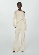 Pantalon de corte wideleg confeccionado en tejido de bambula de algodón, con cintura elástica y bolsillos laterales.