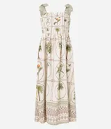 Vestido midi de corte evasé confeccionado en viscolino (mezcla de viscosa y lino). Presenta un diseño con estampado de palmeras y follaje sobre un fondo beige. Cuenta con escote cuadrado, breteles anchos con lazos ajustables en los hombros y espalda con lastex para un ajuste cómodo.