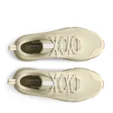 Championes Under Armour Charged Verssert 2 color beige con suela marrón.