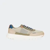Championes color beige con detalles en azul y naranja, con cordones elásticos azules y suela blanca con motas naranjas.
