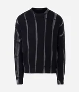 Suéter de punto con diseño texturizado y efecto acid wash, de corte boxy, cuello redondo y manga larga.
