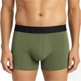Boxer de corte clásico marca Quiksilver, confeccionado en tejido elástico de color verde oliva, con cintura elástica ancha en color negro que presenta el logo de la marca en relieve.