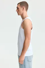 Musculosa de H&M en punto acanalado de mezcla de algodón, con corte ajustado y bajo recto.