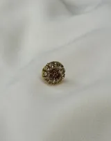 Caravana de resina color lila con strass plateado alrededor, de 1cm de diámetro. Se vende por unidad.