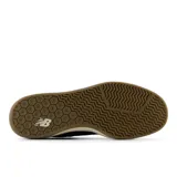 Championes de skate New Balance 440, color azul marino con detalles en marrón y beige.