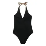 Malla entera de color verde oscuro, combinada con un diseño floreado en la parte inferior. Presenta escote halter cruzado y fruncidos en la zona del abdomen.