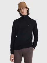 Sweater negro de Tommy Hilfiger con cuello alto y cremallera corta. Tiene el logo de la marca bordado en el pecho.