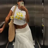 Remera corta blanca con estampa de limones.