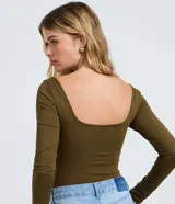 Body de manga larga Blue Steel confeccionado en microfibra de poliamida y elastano. Presenta un diseño ajustado con escote cuadrado y cierre inferior mediante botones de presión.