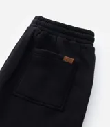 Pantalón de corte recto confeccionado en tejido de algodón y poliéster, con cintura elástica ajustable mediante lazo y bolsillos laterales.